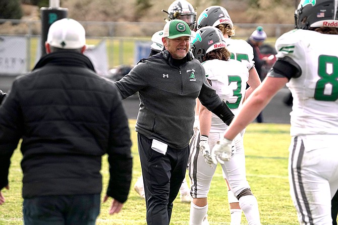 Fallon coach Brooke Hill high-fives senior Jace Nelson after Saturday’s win over North Valleys.