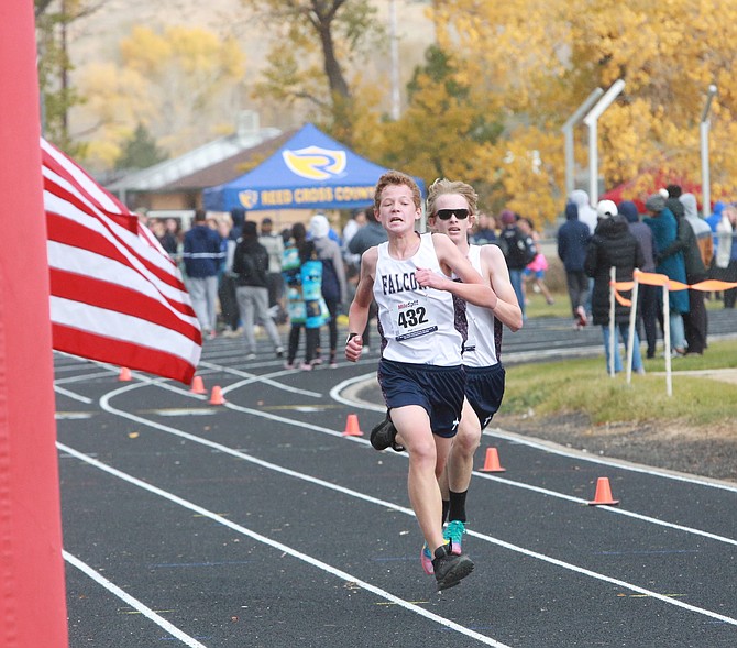 Sierra Lutheran freshmen John Salonites (front) and Joshua Fox sprint into the finish during the Class 1A/2A state cross country meet Saturday. The two took 10th and 11th, respectively.