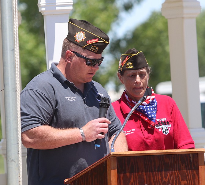 VFW Post 1002 commander Teri Korsmo, right, presides over the 2020 Memorial Day service at The Gardens.