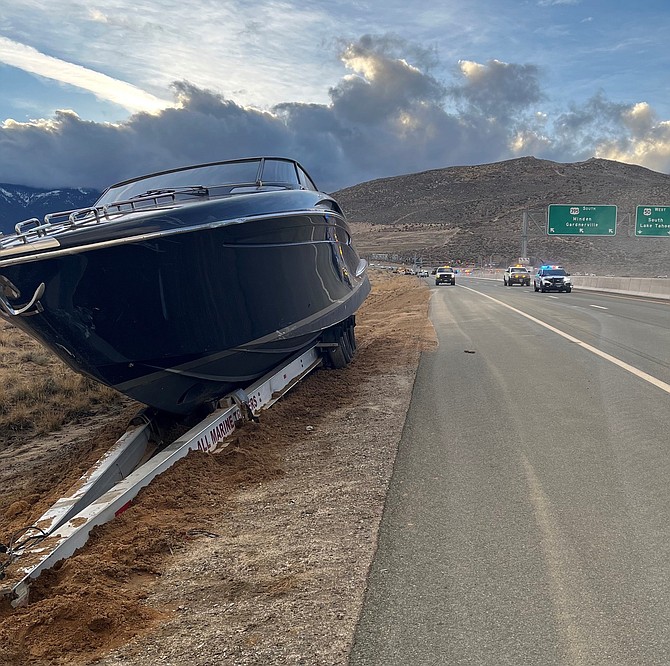 A boat that was being towed down Highway 50 continued hundreds of yards down the Interstate after a collision knocked it loose. NHP photo