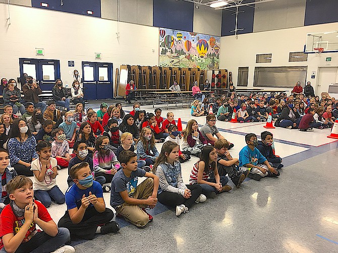 Gardnerville Elementary School students listen attentively as Veterans Day is described on Wednesday.