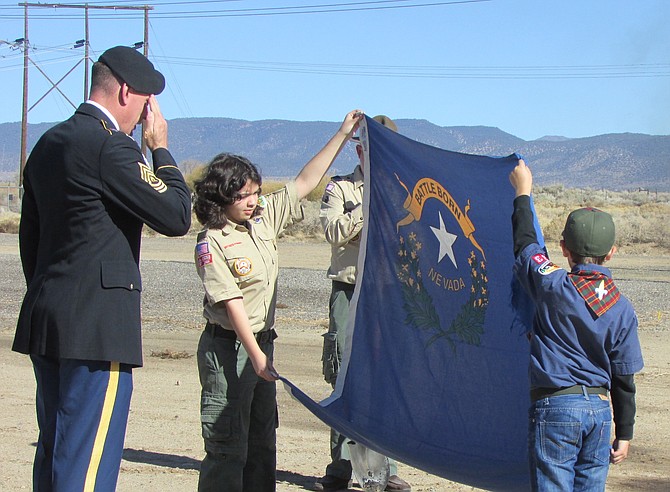 Scouts prepare to retire a Nevada flag on Veterans Day at Eastside Memorial Cemetery. Photo by Sarah Drinkwine