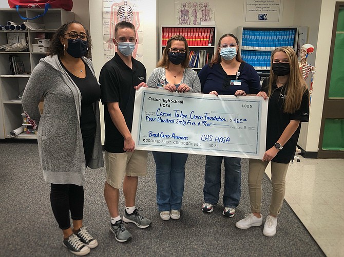 From left, Tiandra Rushing, Nick Batien, Jacklyn Rew, Klanci Madieros and McKenna Budd of Carson High School’s HOSA Future Health Professionals organization provide a $465 donation raised to help Carson Tahoe Health’s Cancer Resource Center.