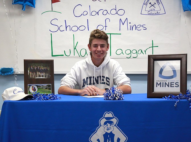 Carson High golfer Lukas Taggart smiles after signing his Letter of Intent to continue his athletic and academic career at the Colorado School of Mines Wednesday inside of Carson High School.