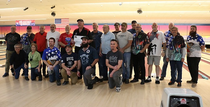 A group of veterans were recognized Nov. 13 at Carson Lanes as part of a check presentation. Carson Country USBC offered a $3,500 donation to Honor Flight Nevada. CCUSBC’s board supports the Bowling Veterans League and the Susan G. Komen Breast Cancer Foundation as its national charities of choice. (Photo: Jessica Garcia/Nevada Appeal)