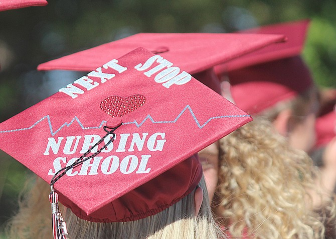 An ASPIRE Academy student proclaims her plans on her hat before the Minden school's graduation ceremony on June 4, 2021.