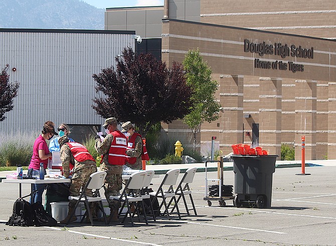 The National Guard and Carson City Health and Human Services conduct a community testing event at Douglas High School on June 24, 2020. After 19 months, the public health agency is suspending testing in favor of vaccinations.