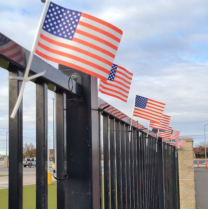 U.S. flags were placed on the day before Veterans Day at Oasis Academy.