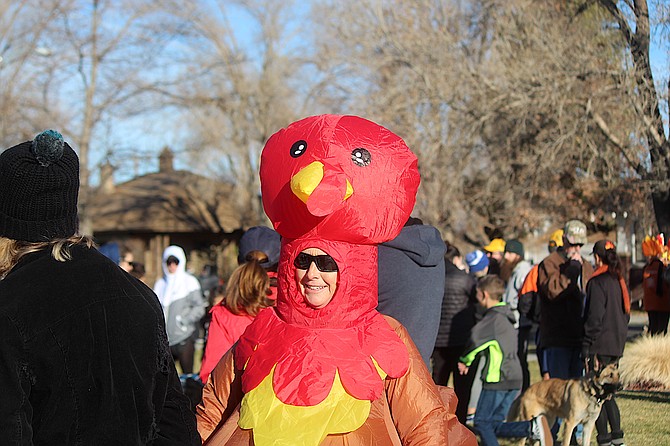 Drum-sticking up some excitement  an organizer dons the turkey costume at Thursday's Turkey Trot in Minden Park.