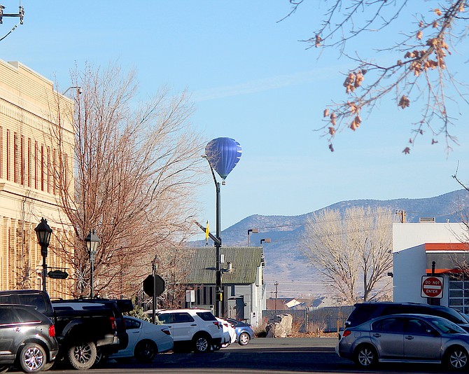 A balloon drifts over Minden on Thursday as runners gather for the Turkey Trot.