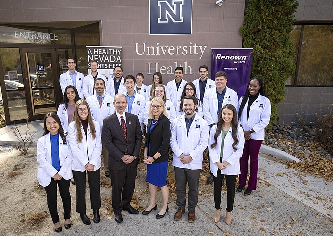 A group of UNR Med first-year and third-year medical students and second-year physician assistant studies program students, who are among the first 25 recipients of the Renown Health Scholarship, appear with Renown Health President & CEO Dr. Tony Slonim and UNR Med Acting Dean and Chief Academic Officer at Renown Health, Dr. Melissa Piasecki.