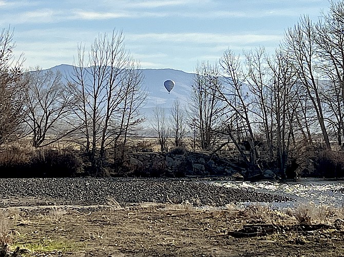 Frank Dressel took this photo of a balloon over Carson Valley with the river in the foreground.