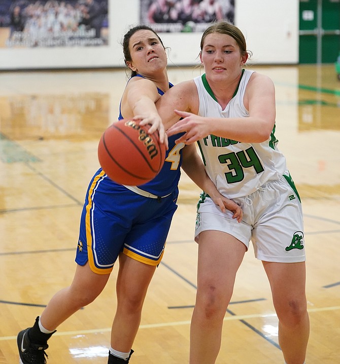 South Tahoe’s Sage Smith, left, and Fallon’s Trinity Helton fight for a loose ball during a game on Dec. 1, 2021. (Photo: Thomas Ranson/LVN)