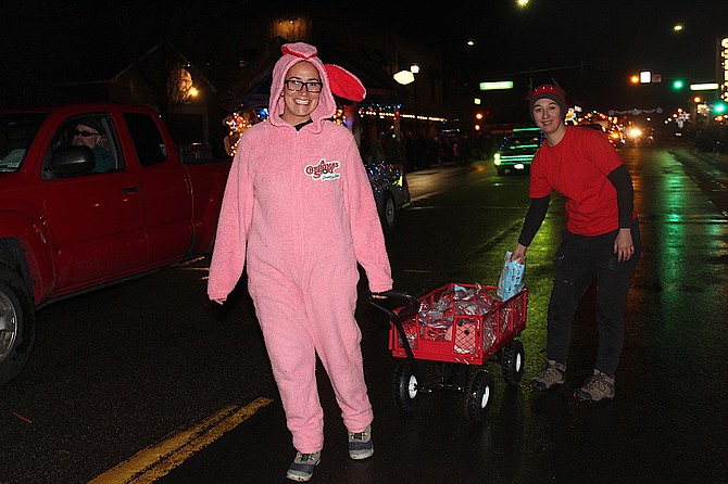 Melissa Strazi tows a wagon of candy as part of the Pau-Wa-Lu Middle School entry in the 2019 Parade of Lights.