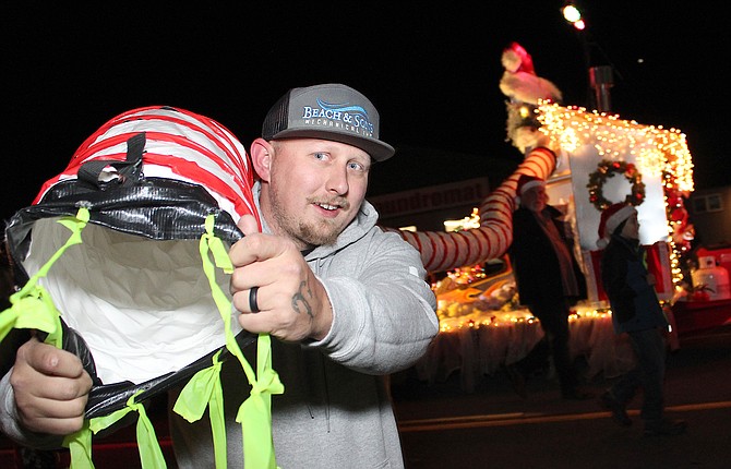 Beach & Sons won the prize for best business float in the 25th Parade of Lights on Saturday.