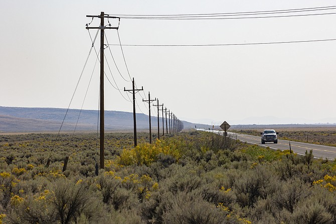 The only power line into the Duck Valley Indian Reservation is pictured along Highway 51 near the Idaho/Nevada border on Sept. 8, 2021. (Kyle Green/NPR, via AP)