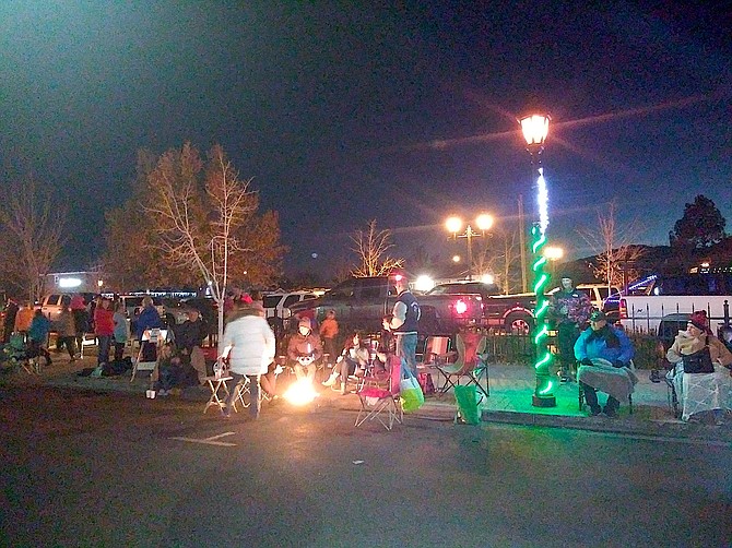 Parade-goers gather along Esmeralda Avenue on Saturday evening for the Parade of Lights. Photo by Kathy Schuman