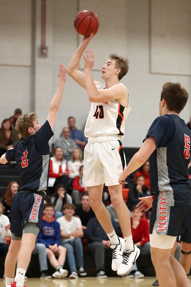 Chris Smalley rises up for a shot during his sophomore season on the Douglas High boys' basketball team. Smalley, a senior, will be one of many highly talented pieces on the Tigers team this winter.