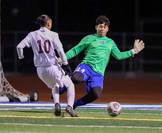 Carson High goalie Rene Gonzalez comes sliding out to breakup a odd-man rush against Sparks earlier this season. Gonzalez was named as the Class 5A North’s Goalkeeper of the year.