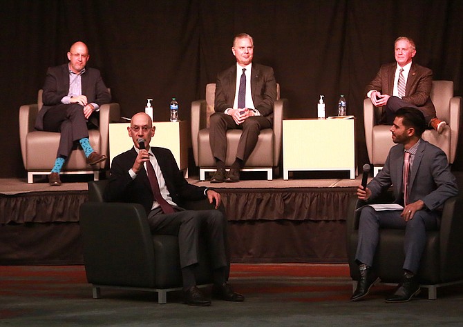 NBA Commissioner Adam Silver speaks during the Reno + Sparks Chamber of Commerce’s ALLIANCE event at the Reno-Sparks Convention Center on Dec. 8, while Reno Aces play-by-play announcer Zack Bayrouty (front row) and, back row from left, Charles Harris, CEO of the Reno-Sparks Convention and Visitors Authority; Greg Mosier, dean of the College of Business at the University of Nevada, Reno; and Vegas Golden Knights President Kerry Bubolz look on.