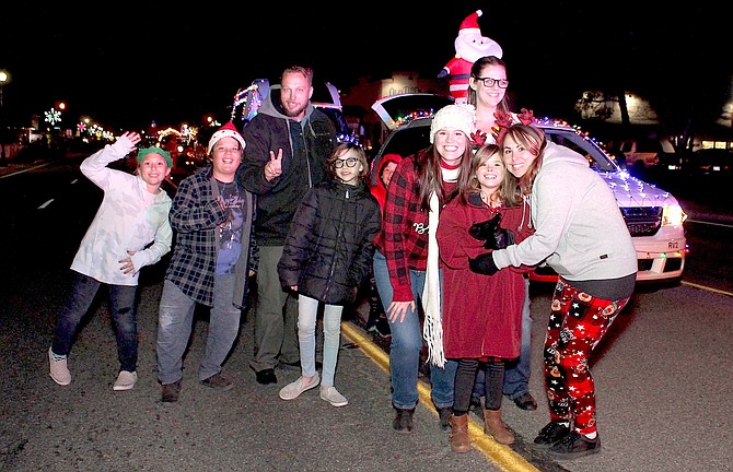 Participants in the 2021 Parade of Lights pause for a photo in Gardnerville.