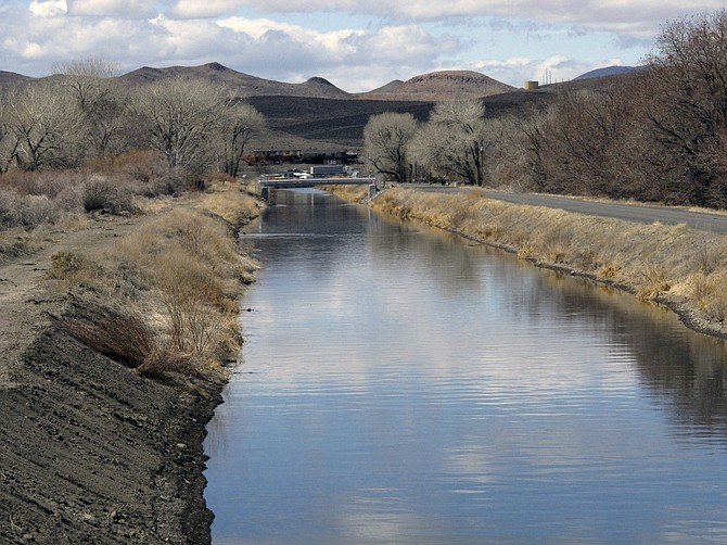 Water flows through an irrigation canal in Fernley on March 18, 2021. (AP Photo/Scott Sonner, File)