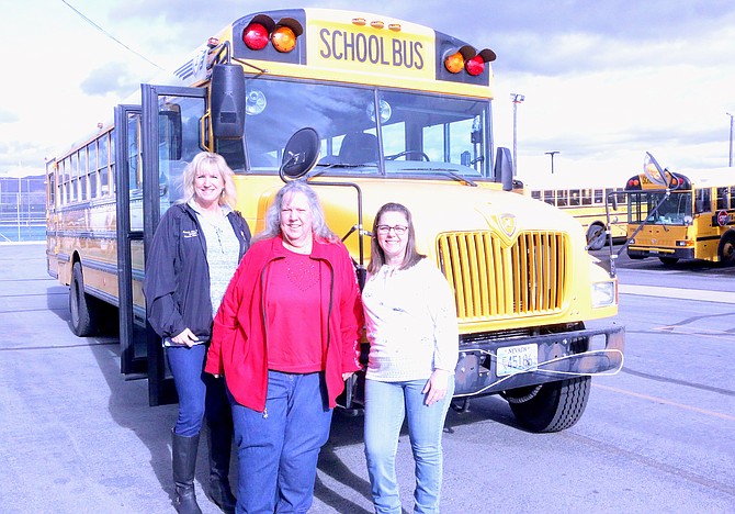 Carson City School District transportation supervisor Cheri Fletcher, left, bus driver Jill Sarge and bus aide Jerri Powers are three of the transportation department’s most tenured employees. Sarge has worked for the district the longest for nearly 42 years and celebrated her retirement this week with her coworkers. (Photo: Jessica Garcia/Nevada Appeal)
