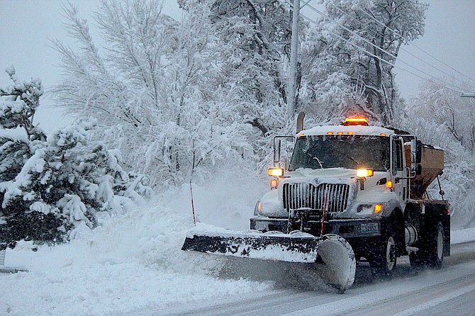 A Douglas County snowplow clears Jacks Valley Road on Tuesday morning.l