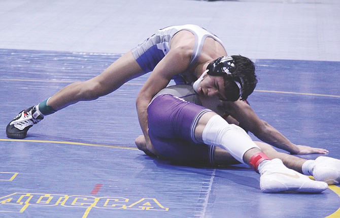 Carson High wrestler Anthony Garrabo works atop an opponent Saturday in Winnemucca. Garrabo took fourth at 126 pounds during the Senators second event of the season.