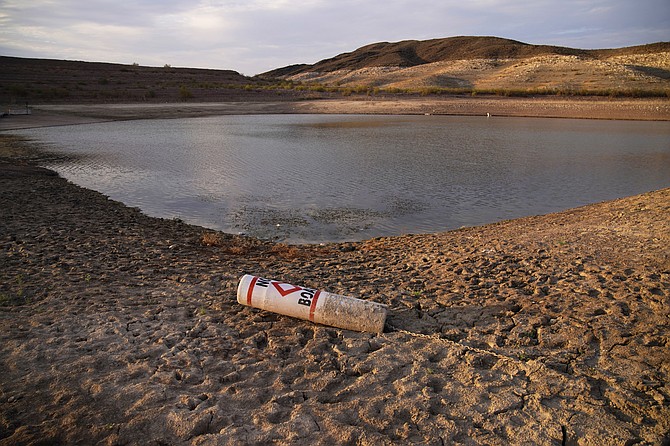 A buoy rests on the ground at a closed boat ramp at the Lake Mead National Recreation Area near Boulder City on Aug. 13, 2021. (AP Photo/John Locher, File)