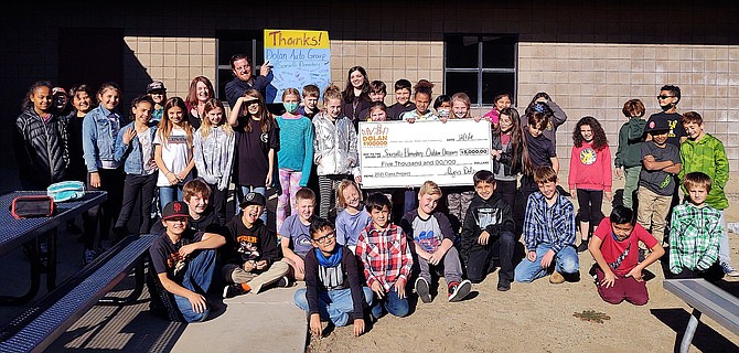 Dolan Auto Group donated $5,000 to Scarselli Elementary School on Dec. 1.