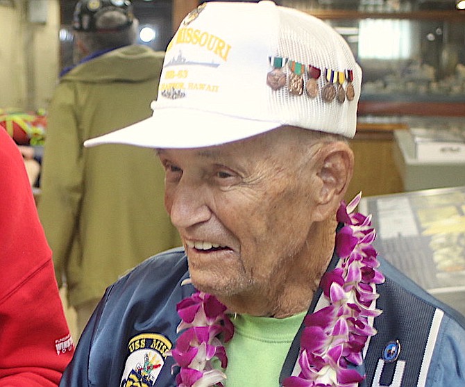 John “Jack” Delaney looks at rusty nuts that tightened the teak planks of the USS Missouri during an Honor Flight Nevada trip to Oahu from Dec. 6-10.