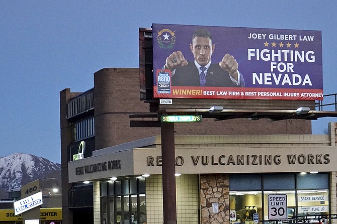 A billboard advertises legal services for Joey Gilbert in Reno on Dec. 16, 2021. (AP Photo/Sam Metz)