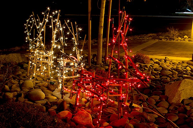 Willow reindeer are lit up along Highway 395 in Minden on Thursday night.