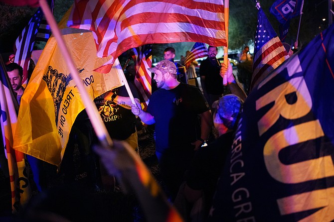 Supporters of President Donald Trump protest the Nevada vote in front of the Clark County Election Department in Las Vegas on Nov. 5, 2020. (AP Photo/John Locher, File)