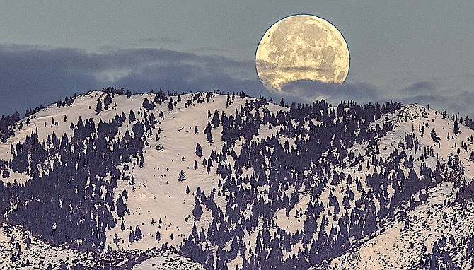 J.T. Humphrey's photo of the full moon over the Carson Range welcomes the first day of winter 2021-22.