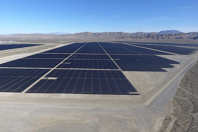 Solar arrays line the desert floor of the Dry Lake Solar Energy Zone as part of the 179 megawatt Switch Station 1 and Switch Station 2 Solar Projects north of Las Vegas on Dec. 11, 2017. (Michael Quine/Las Vegas Review-Journal via AP, File)