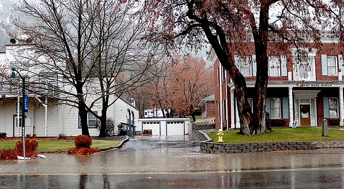A big puddle crosses the southbound lanes of Main Street in Genoa on Thursday morning.