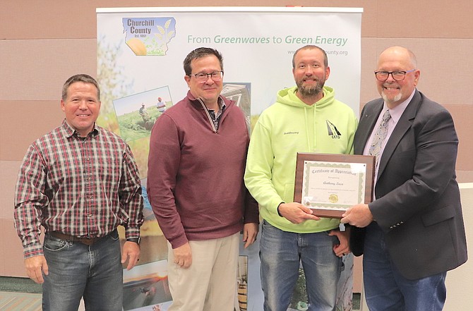 County Commissioners recognized Anthony Laca, Road Department, for 10 years of service. From left are commissioners Justin Heath and Greg Koenig, Laca and Commission Chairman Pete Olsen.