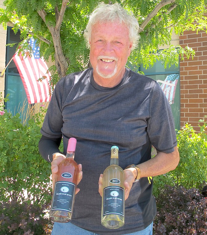 Greg Ross with two of his 2017 wines in this R-C file photo
