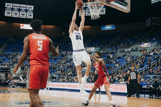 Nevada’s Will Baker throws down a dunk against New Mexico on Jan. 1, 2022 at Lawlor Events Center in Reno. (Photo: Nevada Athletics)