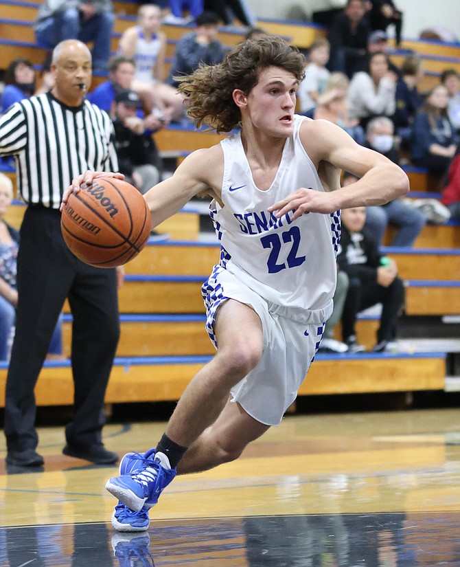 Parker Story drives baseline for Carson High boys basketball Thursday evening against Reed. Story drew several charges for the Senators and added four points to his resume.