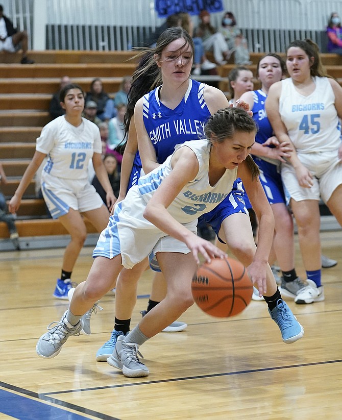 Oasis Academy’s Taylynn Maynez dribbles around Smith Valley’s defense in Saturday’s game.