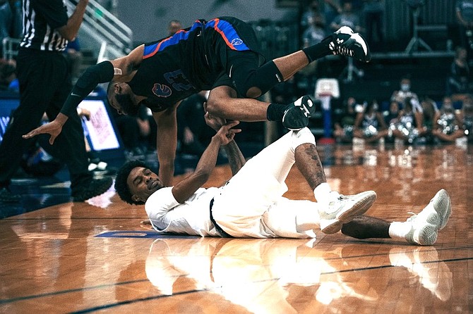 Nevada’s Desmond Cambridge, Jr., is fouled by a Boise State player on Jan. 12, 2022 at Lawlor Events Center in Reno. (Photo: Nevada Athletics)