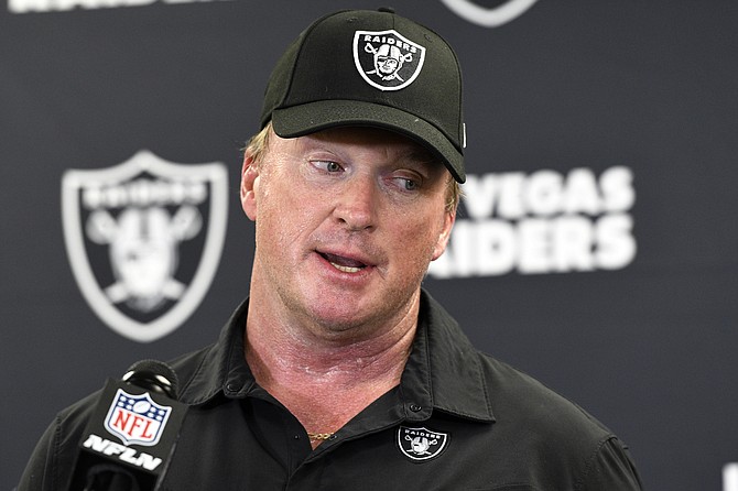 Then-Las Vegas Raiders head coach Jon Gruden speaks with the media following a game against the Pittsburgh Steelers in Pittsburgh on Sept. 19, 2021. (AP Photo/Don Wright, File)