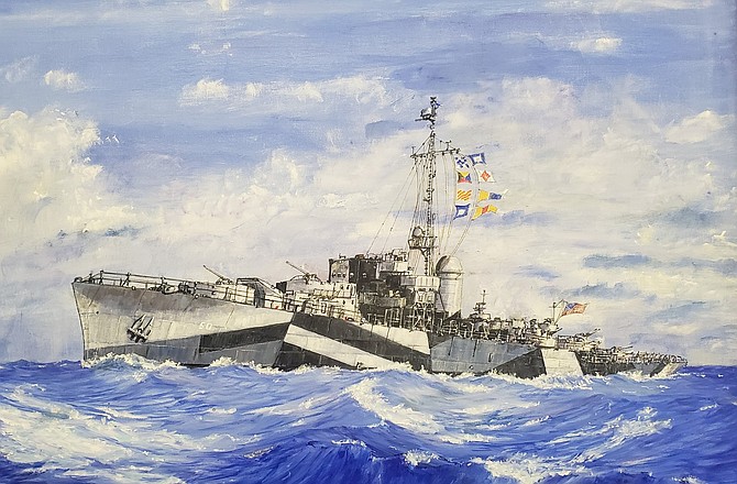 The USS Carson City's portrait somewhere in the Pacific Ocean displaying her camouflage paint. The camouflage paint disrupts an enemy from obtaining an accurate fix when viewing the ship through a periscope for a torpedo attack.