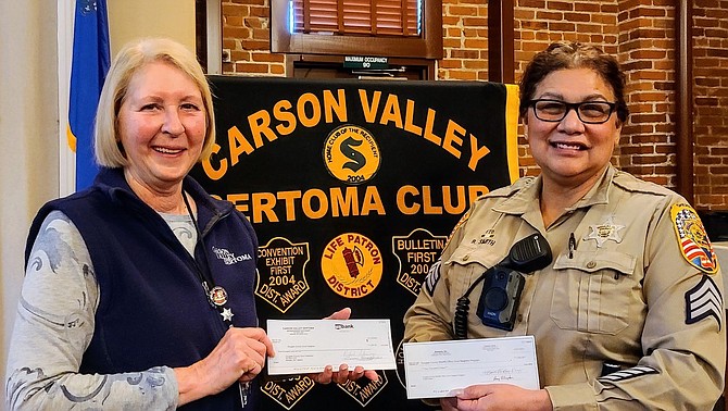 Carson Valley Sertoma Sponsorship Chair Dianne Ford and Douglas County Sheriff’s Department Good Neighbor creator Sgt. Bernadette Smith.