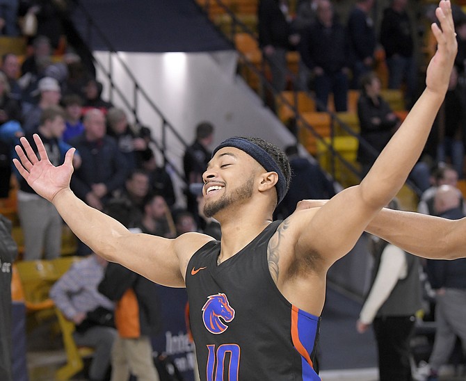 Boise State guard Marcus Shaver Jr. (10) celebrates after defeating Utah State in an NCAA college basketball game Thursday, Jan. 20, 2022, in Logan, Utah. (Eli Lucero/The Herald Journal via AP)
