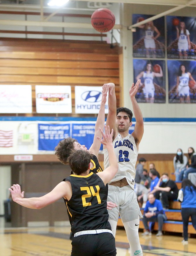 Carson High's Parsa Hadjighasemi launches a 3-pointer against Galena Tuesday night. Hadjighasemi hit eight triples on the evening, which is believed to be a Senator single-game high school record.