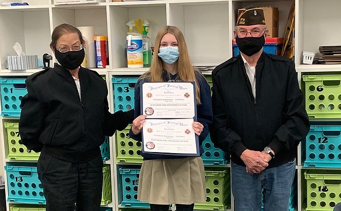 Oasis eight grader Christina Robinson, center, placed first in the state in the Veterans of Foreign Wars Patriot’s Pen essay contest. With her is Ramona Terry, left, and Michael Terry, both from Fallon VFW Post 1002 and its auxiliary.